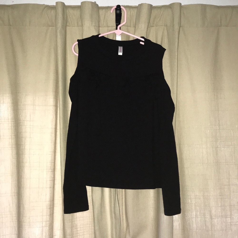 A cold shoulder top with long sleeves.
